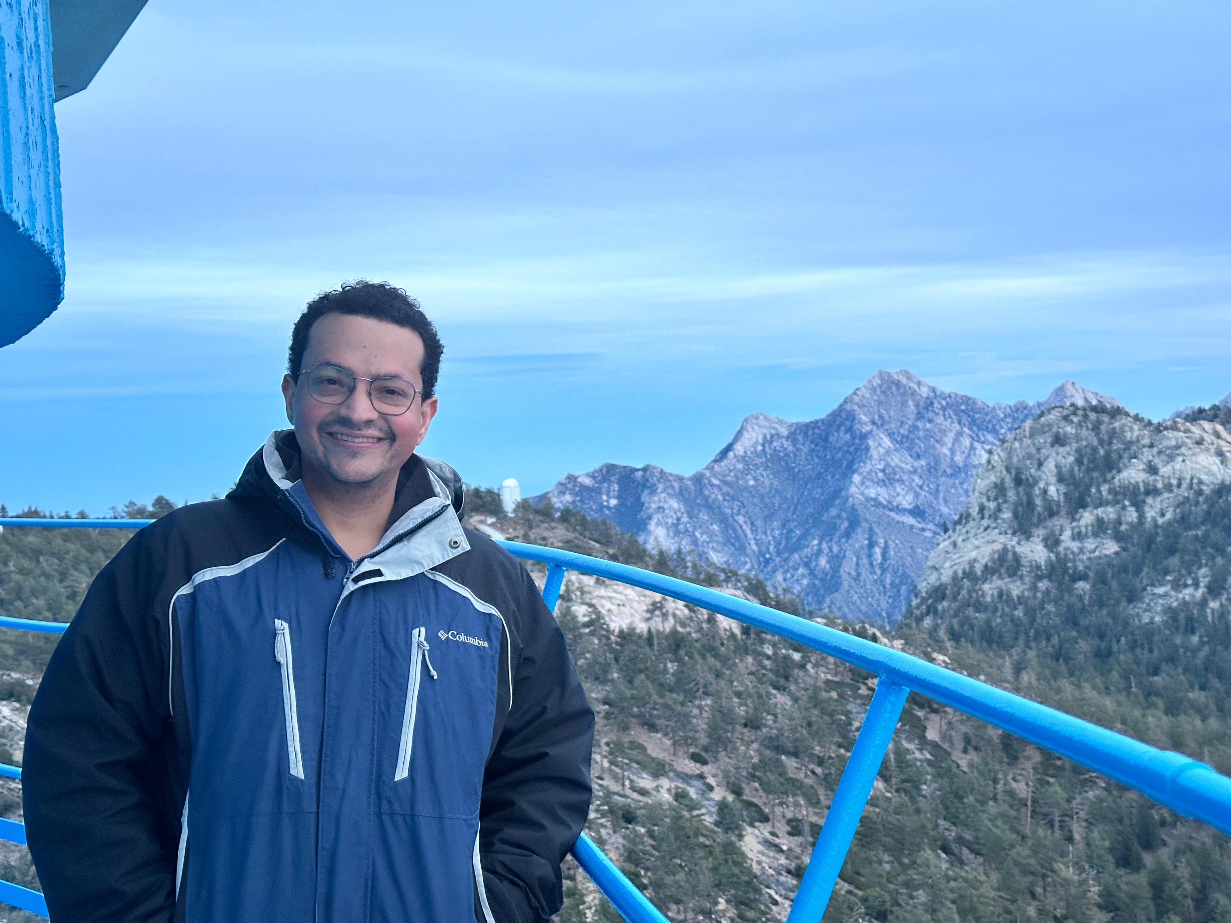Manuel Pichardo Marcano outdoors with mountains in the background